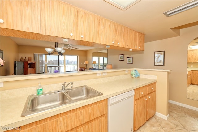 kitchen with ceiling fan, dishwasher, light tile patterned floors, and sink