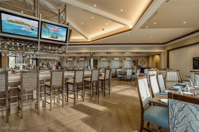 bar featuring crown molding and a tray ceiling