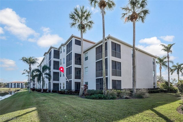 view of building exterior with a water view