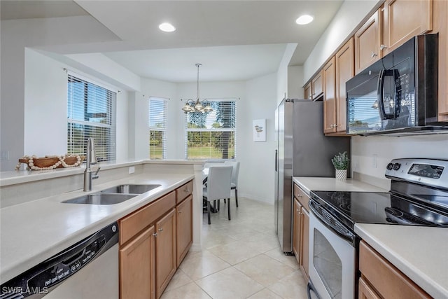 kitchen featuring an inviting chandelier, sink, hanging light fixtures, light tile patterned floors, and stainless steel appliances