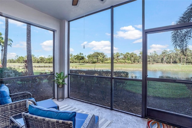 sunroom / solarium with a healthy amount of sunlight and a water view