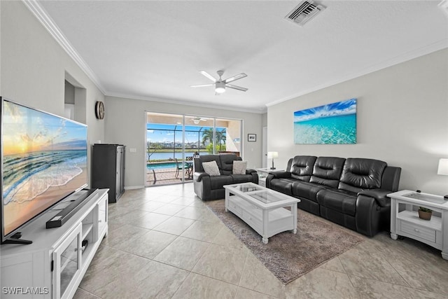 living room featuring ceiling fan, light tile patterned flooring, and crown molding