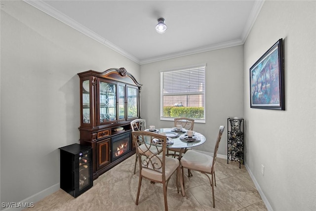 dining space with light tile patterned floors and crown molding