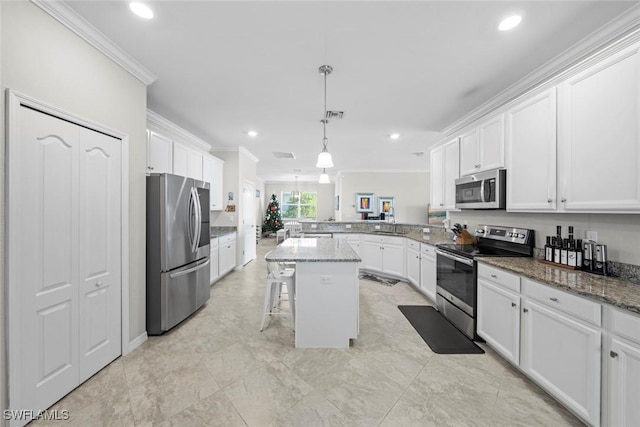 kitchen featuring a center island, stainless steel appliances, kitchen peninsula, dark stone countertops, and a breakfast bar area