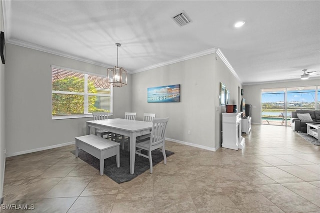 dining space with light tile patterned floors, ceiling fan with notable chandelier, plenty of natural light, and crown molding