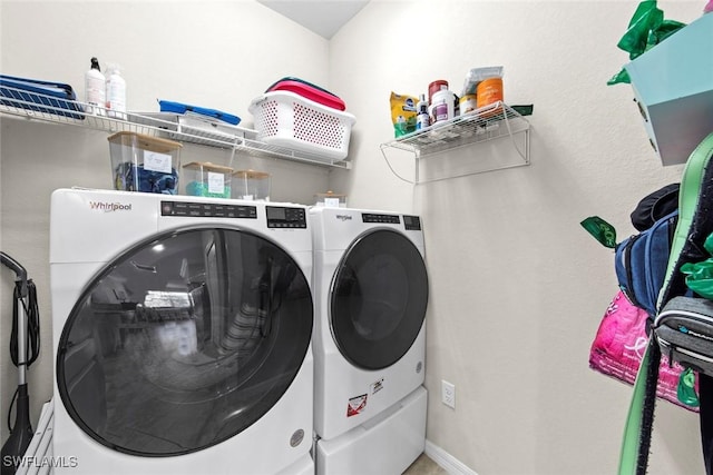 laundry room with washing machine and dryer