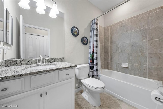 full bathroom with tile patterned floors, vanity, toilet, and shower / tub combo