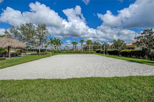 view of community featuring a gazebo, volleyball court, and a lawn