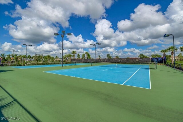 view of sport court with basketball hoop