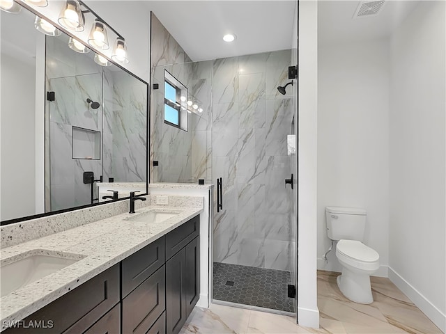 bathroom featuring vanity, toilet, and a shower with door