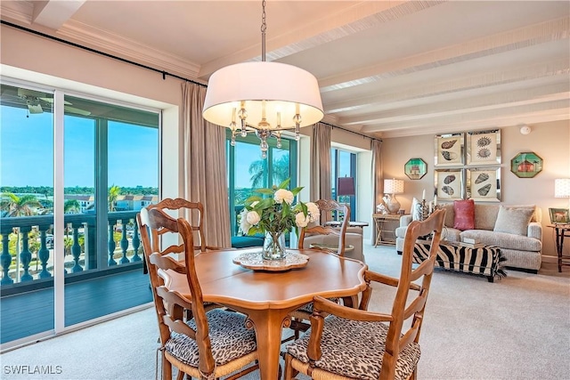 dining space with a chandelier, crown molding, plenty of natural light, and beamed ceiling