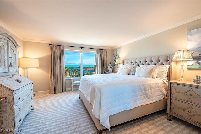 carpeted bedroom featuring crown molding