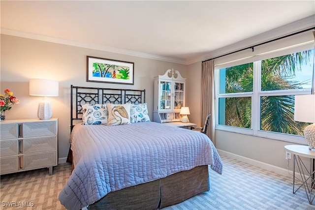 bedroom with light carpet and crown molding