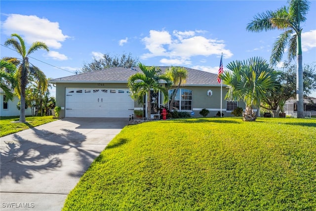 single story home featuring a garage and a front yard