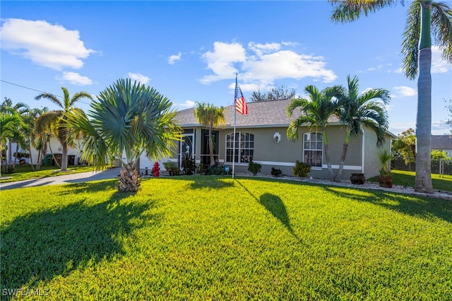 ranch-style house with a front lawn