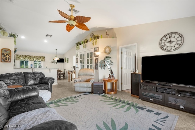 tiled living room with ceiling fan and vaulted ceiling