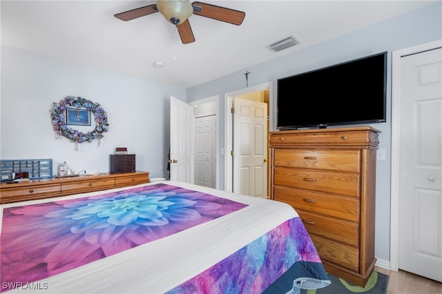 bedroom with hardwood / wood-style flooring and ceiling fan