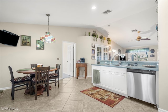 1744 SW 15th St, Cape Coral, FL 33991 - kitchen with dishwasher, lofted ceiling, white cabinetry, ceiling fan, and light tile patterned floors
