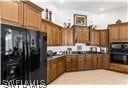 kitchen featuring black fridge