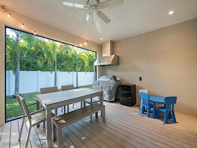 deck with ceiling fan and area for grilling