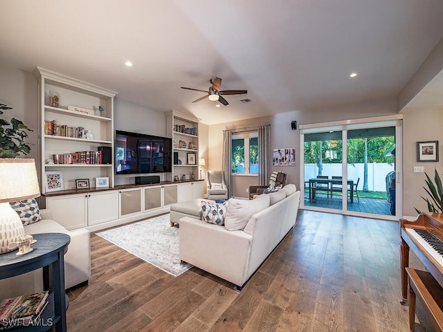 living room featuring hardwood / wood-style floors and ceiling fan