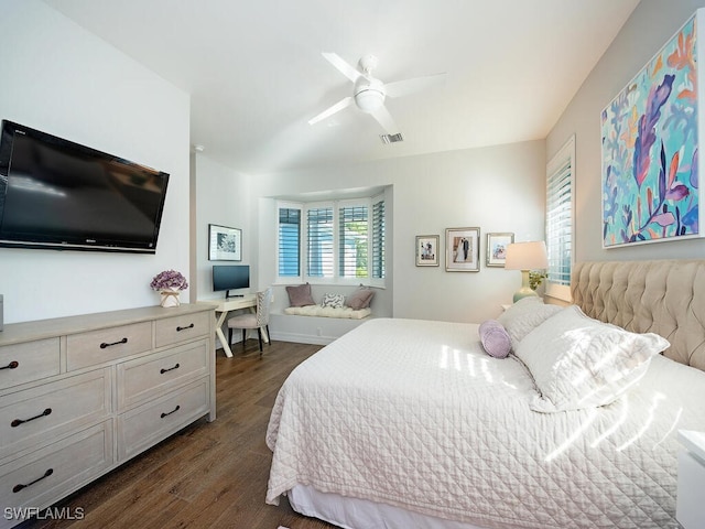 bedroom with dark hardwood / wood-style floors and ceiling fan