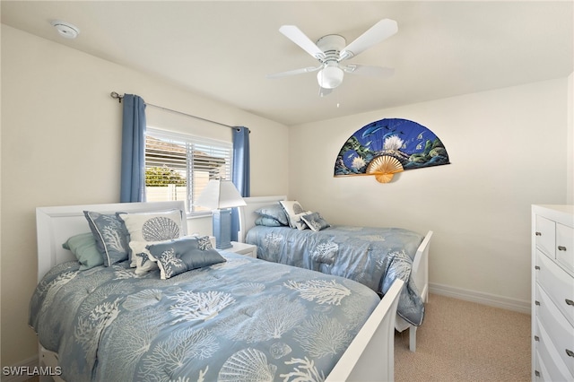 bedroom with ceiling fan and light colored carpet