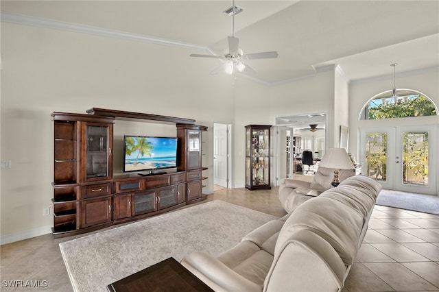 tiled living room with french doors, high vaulted ceiling, ceiling fan, and ornamental molding