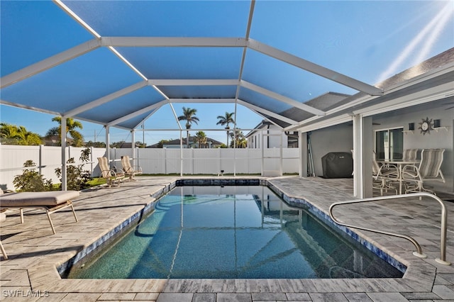 view of pool with a lanai and a patio area