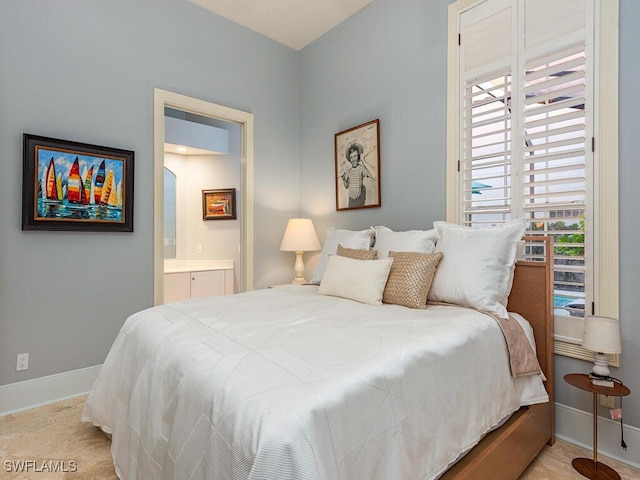 tiled bedroom featuring connected bathroom