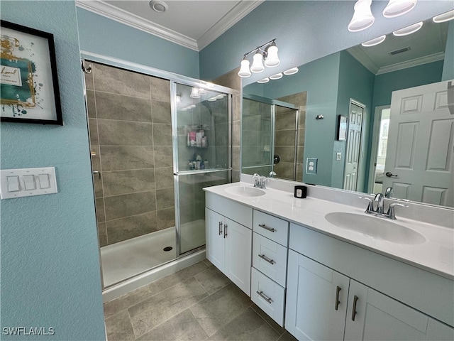 bathroom with vanity, a shower with shower door, and crown molding