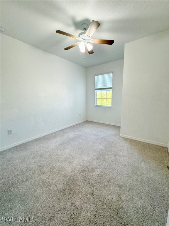 unfurnished room featuring carpet and ceiling fan