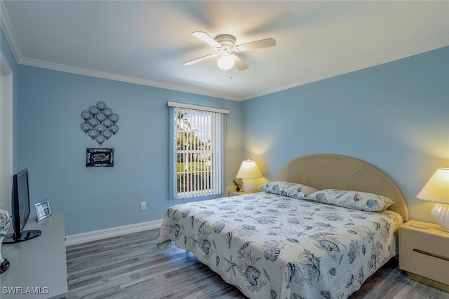 bedroom with ceiling fan, crown molding, and wood-type flooring