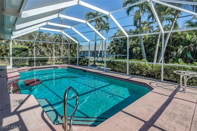 view of pool featuring a patio area and a lanai