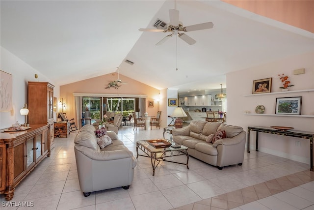 tiled living room featuring ceiling fan and high vaulted ceiling