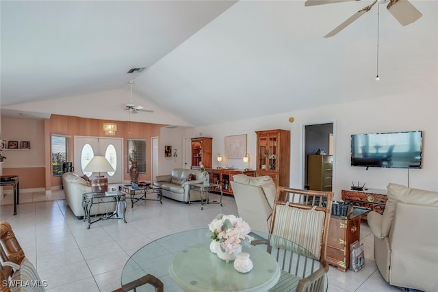 tiled dining room with french doors, high vaulted ceiling, and ceiling fan