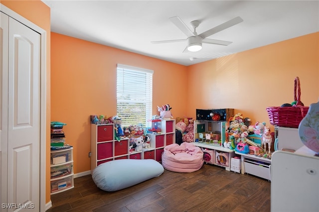 game room with dark hardwood / wood-style flooring and ceiling fan