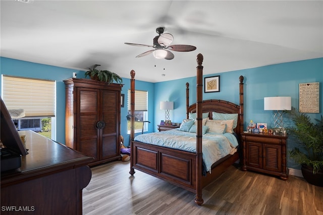 bedroom with hardwood / wood-style floors and ceiling fan