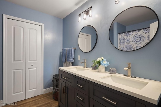 3507 SW 15th Ave, Cape Coral, FL 33914 - bathroom featuring double vanity and wood finished floors