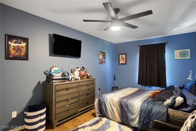 bedroom with light wood-type flooring and ceiling fan