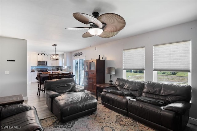 3507 SW 15th Ave, Cape Coral, FL 33914 - living room featuring healthy amount of natural light, light wood-style floors, and ceiling fan