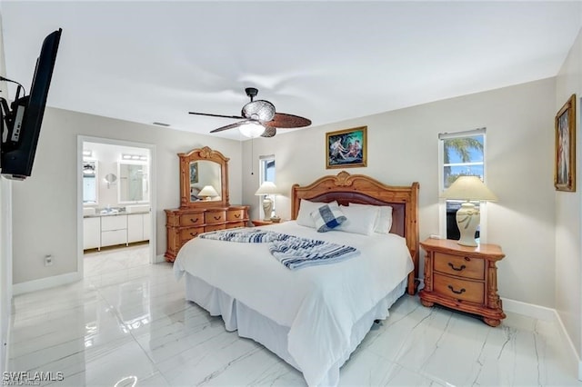 bedroom featuring ceiling fan and ensuite bathroom