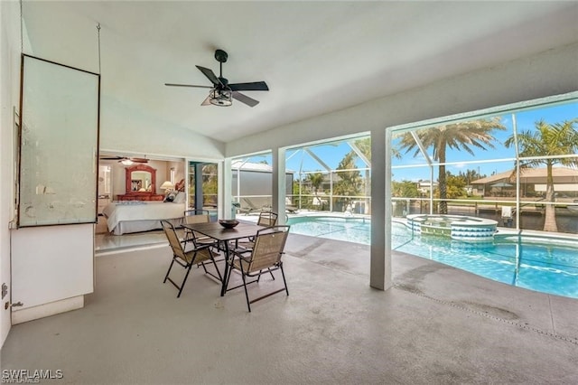 sunroom featuring ceiling fan, a swimming pool, and lofted ceiling