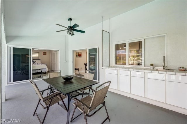 view of patio featuring ceiling fan and sink