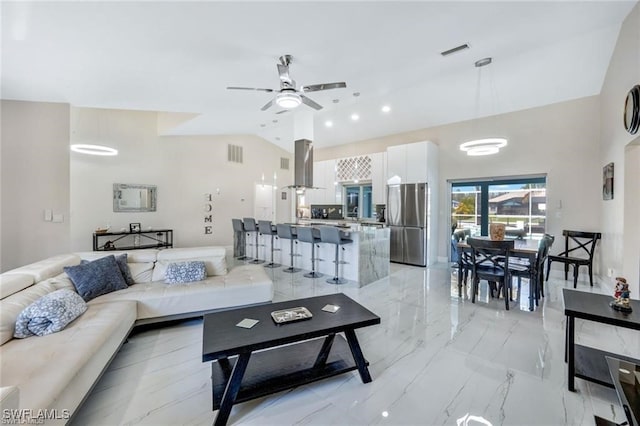 living room with ceiling fan and high vaulted ceiling