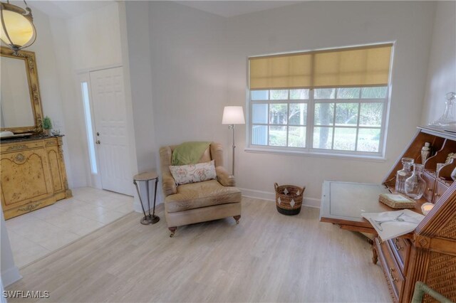 486 Edgemere Way E Unit 2-3, Naples, FL 34105 - living area with light wood-style floors and baseboards