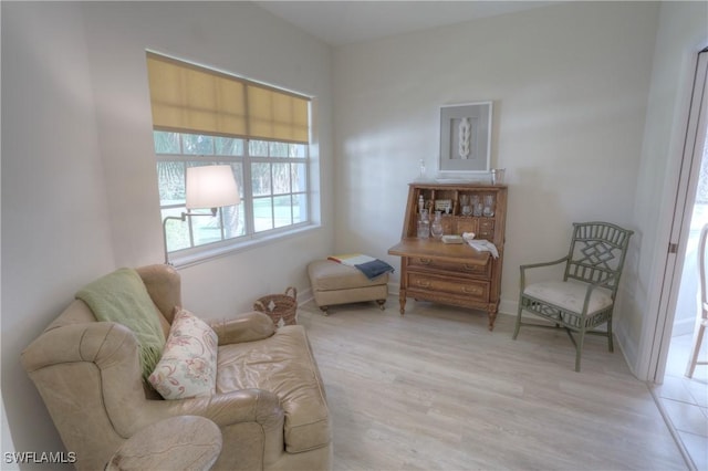486 Edgemere Way E Unit 2-3, Naples, FL 34105 - living area featuring light wood finished floors