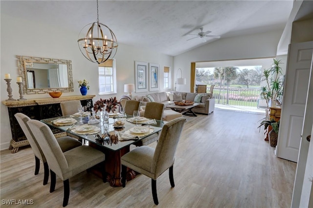 486 Edgemere Way E Unit 2-3, Naples, FL 34105 - dining area with lofted ceiling, light wood-type flooring, a chandelier, and a ceiling fan