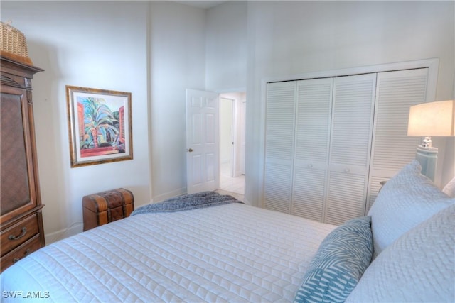486 Edgemere Way E Unit 2-3, Naples, FL 34105 - bedroom featuring a closet and a towering ceiling
