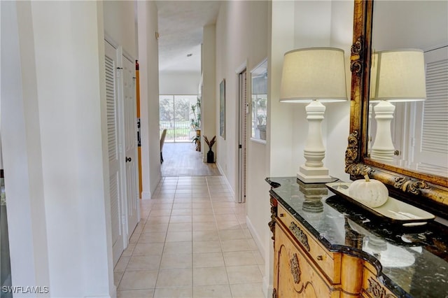 486 Edgemere Way E Unit 2-3, Naples, FL 34105 - hall featuring light tile patterned floors and baseboards
